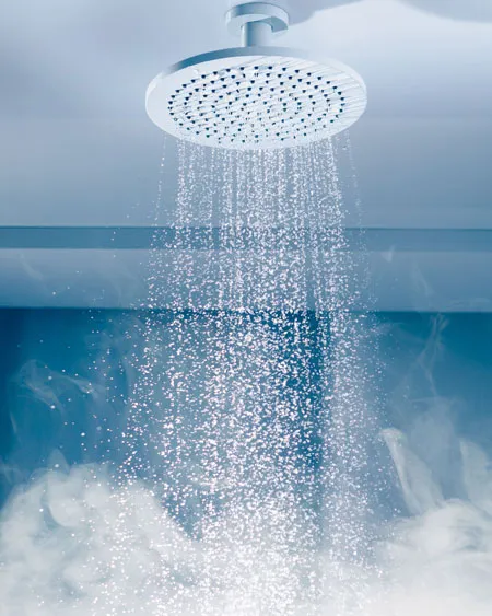 How water is pouring from a shower that is connected to instant water heater