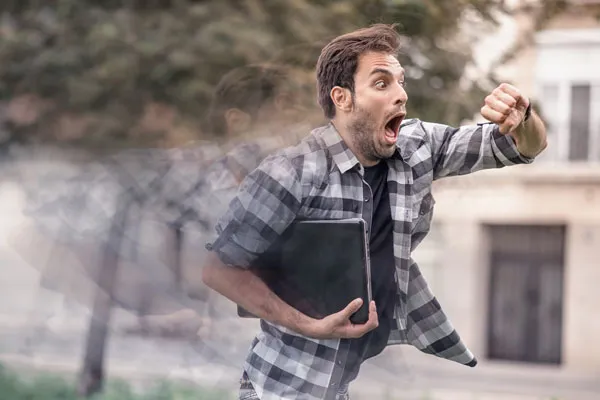 A figure of a man who is shocked when check time